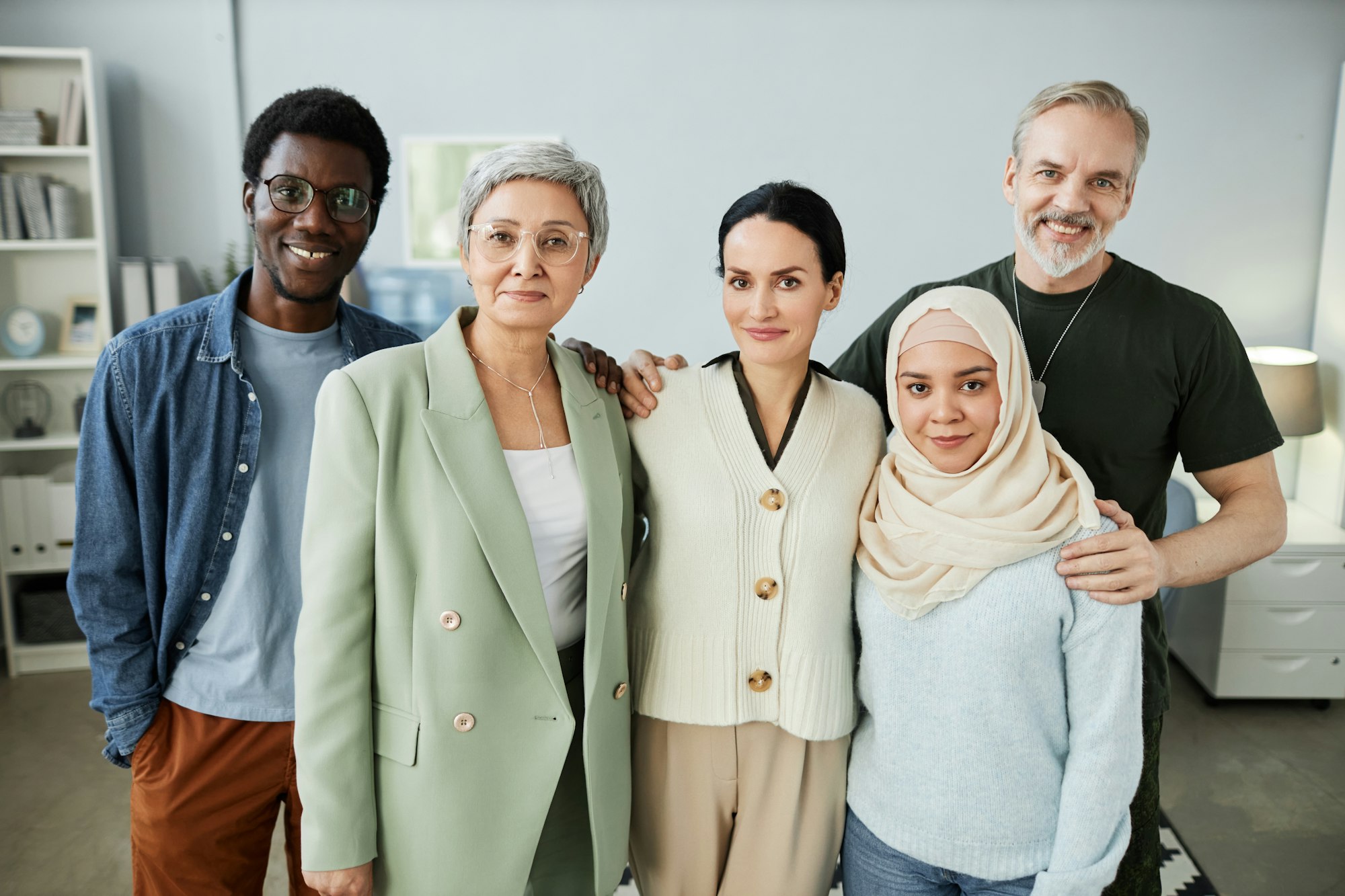 Group of patients of psychological course and mature female counselor